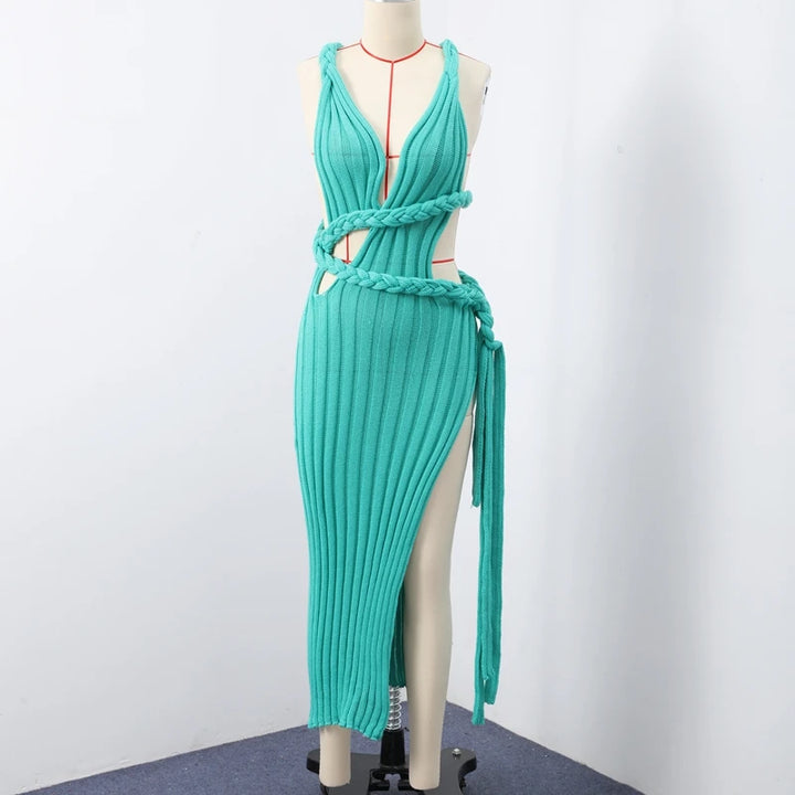 Teal dress on a mannequin against a white background
