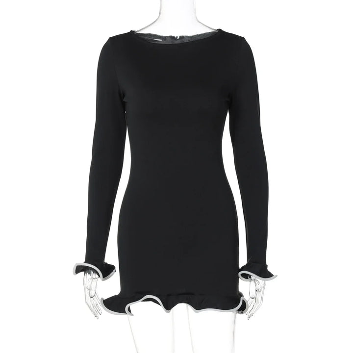 Black dress with long sleeves on a mannequin against a white background