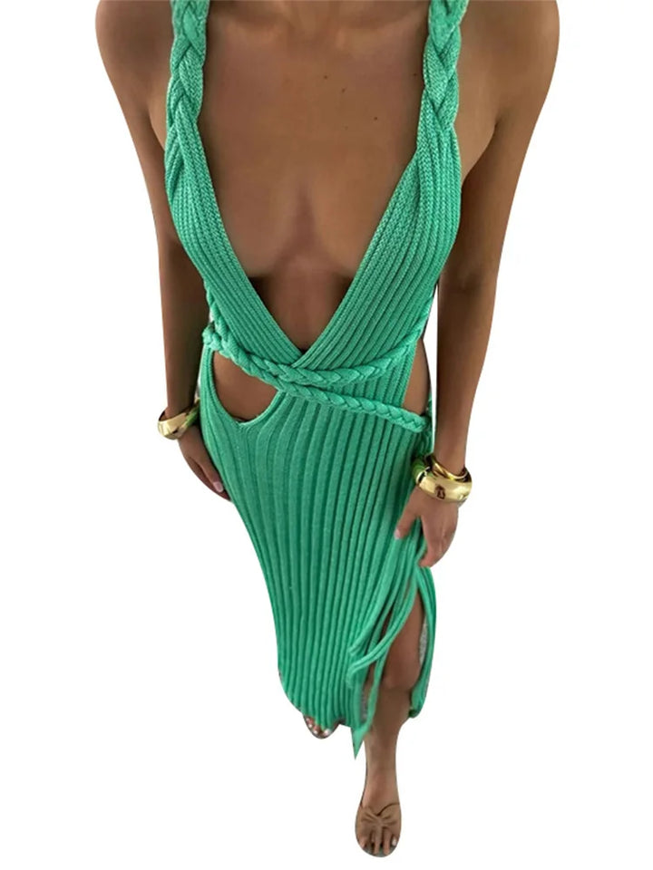 Green ribbed swimsuit with a backless design on a white background