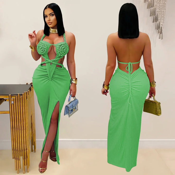 Green dress with cut-out design worn by a model indoors.