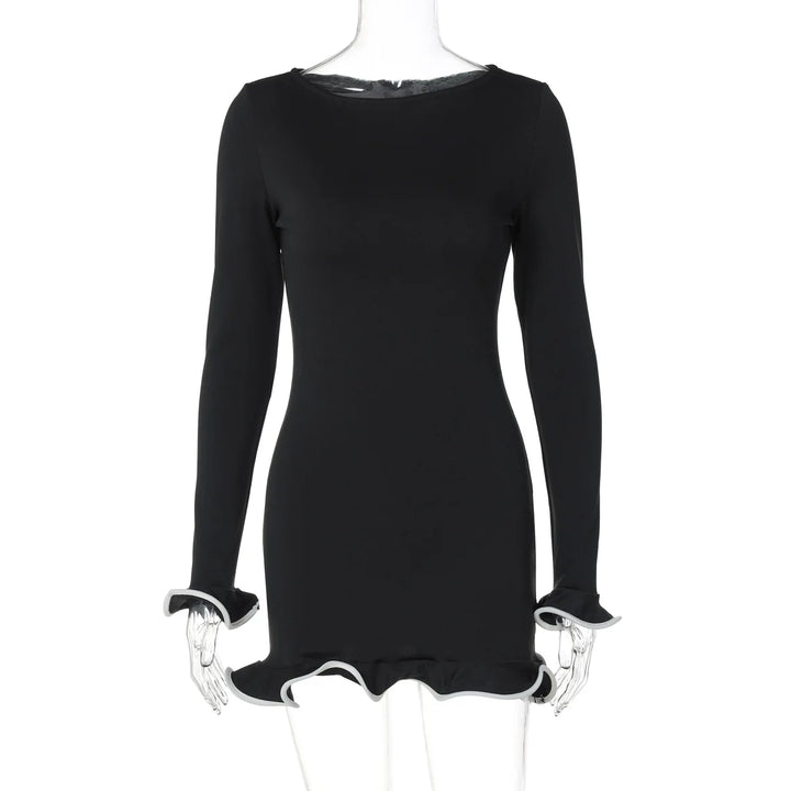 Black dress with long sleeves on a mannequin against a white background
